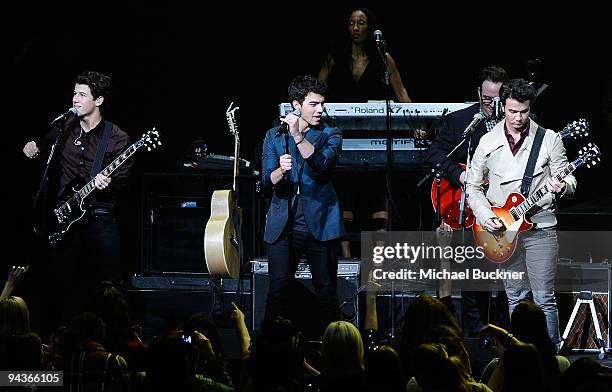 Nick Jonas, Joe Jonas and Kevin Jonas perform at Stevie Wonder's House Full of Toys Benefit Concert at Nokia LA Live on December 12, 2009 in Los...