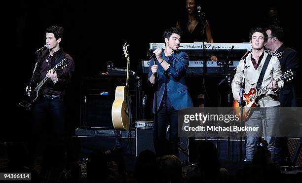 Nick Jonas, Joe Jonas and Kevin Jonas perform at Stevie Wonder's House Full of Toys Benefit Concert at Nokia LA Live on December 12, 2009 in Los...