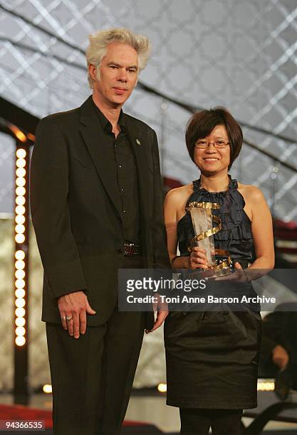 Jim Jarmusch presents Charlotte Lim Lay Kuen her award during the Closing Ceremony of the Marrakech 9th Film Festival at the Mansour Hotel - Palais...