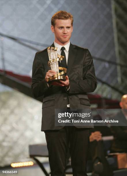 Cyron Melville poses with his awards during the Closing Ceremony of the Marrakech 9th Film Festival at the Mansour Hotel - Palais des Congres on...