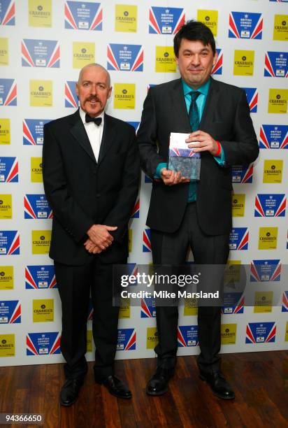 Graham Linehan wins the Ronnie Barker Writers' Guild of Great Britain Award, presented by Griff Rhys Jones poses in the press room at the British...