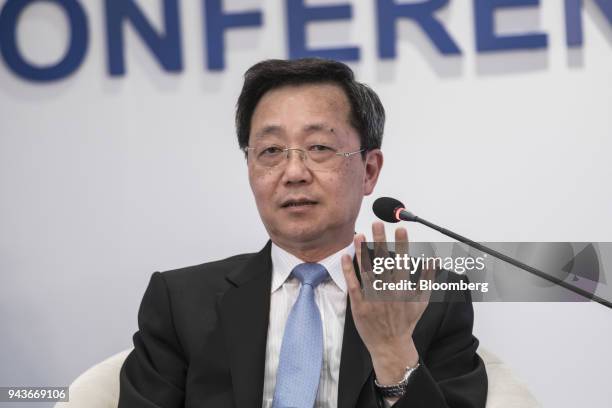 Xu Lirong, chairman of China COSCO Shipping Corp., gestures as he speaks during a session at the Boao Forum for Asia Annual Conference in Boao,...