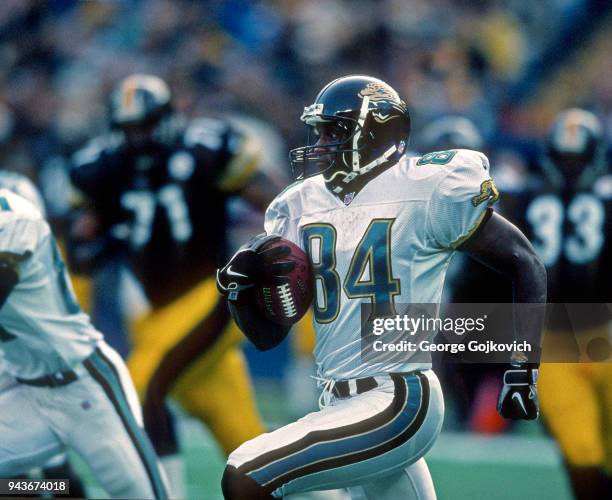 Wide receiver Reggie Barlow of the Jacksonville Jaguars runs with the football during a game against the Pittsburgh Steelers at Three Rivers Stadium...