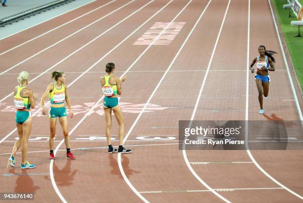 Lineo Chaka of Lesotho is applauded by Eloise Wellings of Australia, Madeline Hills of Australia and Celia Sullohern of Australia as she finishes the...