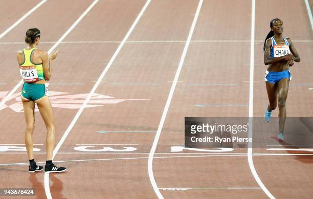 Lineo Chaka of Lesotho is applauded by Madeline Hills of Australia as she finishes the Women's 10,000 metres final during the Athletics on day five...
