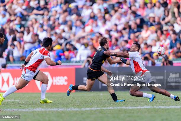 Bastian Himmer of Germany fights with Jone Naikabula of Japan during the HSBC Hong Kong Sevens 2018 Qualification Final match between Germany and...