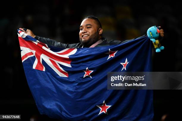 David Liti of New Zealand celebrates after receiving the gold medal in the Men's +105kg Final during the Weightlifting on day five of the Gold Coast...