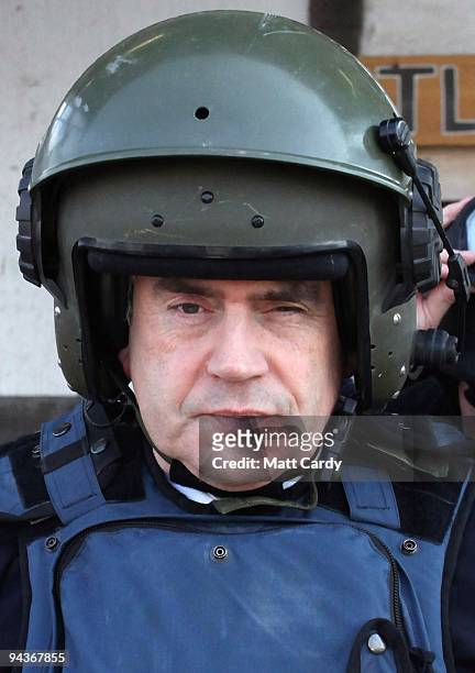 Prime Minister Gordon Brown wears a helmet and body armour as he leaves 'Little Heathrow' at Kandahar Airbase on December 13, 2009 in Kandahar,...