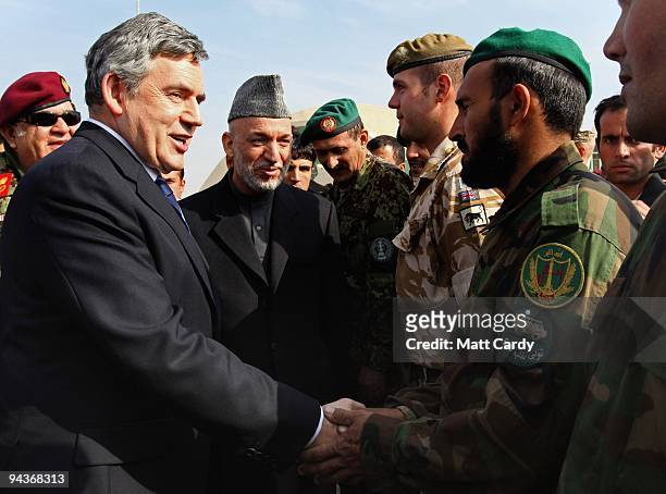 Prime Minister Gordon Brown and Afghan President Hamid Karzai meet Afghan and British troops at Kandahar Airbase on December 13, 2009 in Kandahar,...