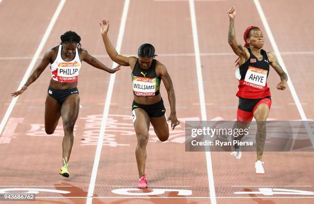 Michelle-Lee Ahye of Trinidad and Tobago celebrates winning gold ahead of Christania Williams of Jamaica and Asha Philip of England in the competes...