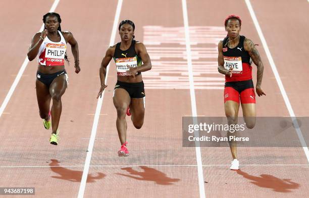 Michelle-Lee Ahye of Trinidad and Tobago races to the line to win gold ahead of Christania Williams of Jamaica and Asha Philip of England in the...