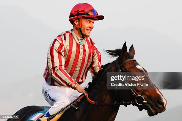 Olivier Peslier from France riding Vision D'etat celebrates after winning celebrates after winning the Cathay Pacific Hong Kong Cup race 8 during the...