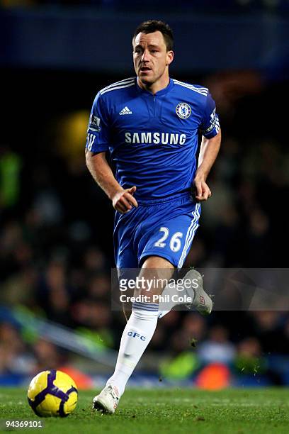 John Terry of Chelsea runs with the ball during the Barclays Premier League match between Chelsea and Everton at Stamford Bridge on December 12, 2009...