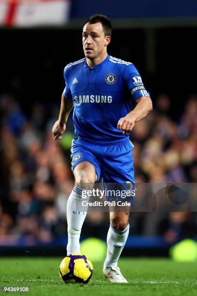 John Terry of Chelsea runs with the ball during the Barclays Premier League match between Chelsea and Everton at Stamford Bridge on December 12, 2009...