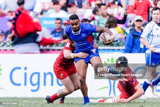 Afon Bagshaw of Wales tries to tackle David Afamasaga of Samoa during the HSBC Hong Kong Sevens 2018 Shield Final match between Samoa and Wales on...