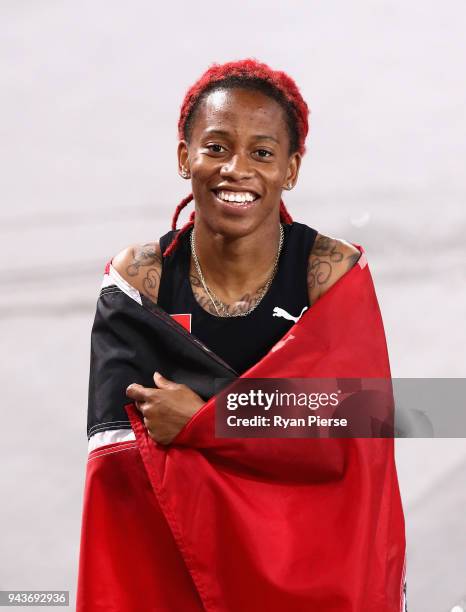 Michelle-Lee Ahye of Trinidad and Tobago celebrates winning gold in the Women's 100 metres final during the Athletics on day five of the Gold Coast...