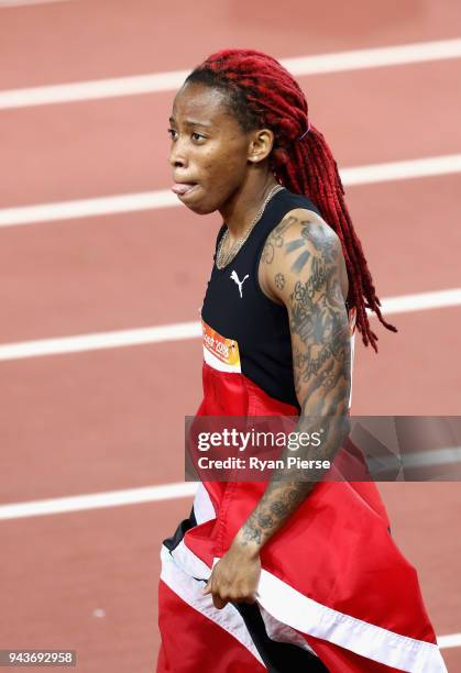 Michelle-Lee Ahye of Trinidad and Tobago celebrates winning gold in the Women's 100 metres final during the Athletics on day five of the Gold Coast...