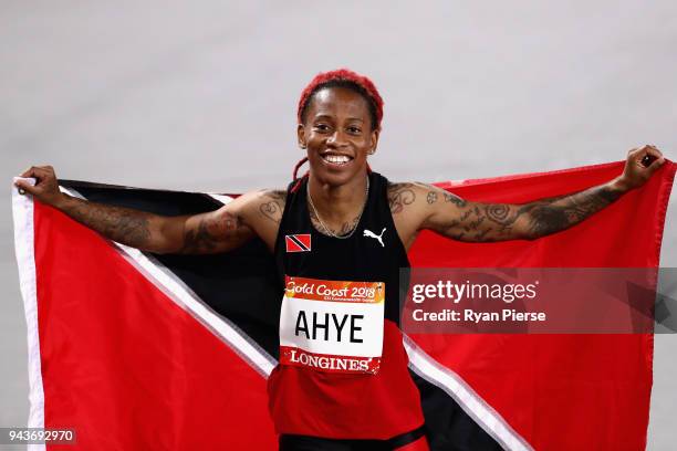 Michelle-Lee Ahye of Trinidad and Tobago celebrates winning gold in the Women's 100 metres final during the Athletics on day five of the Gold Coast...