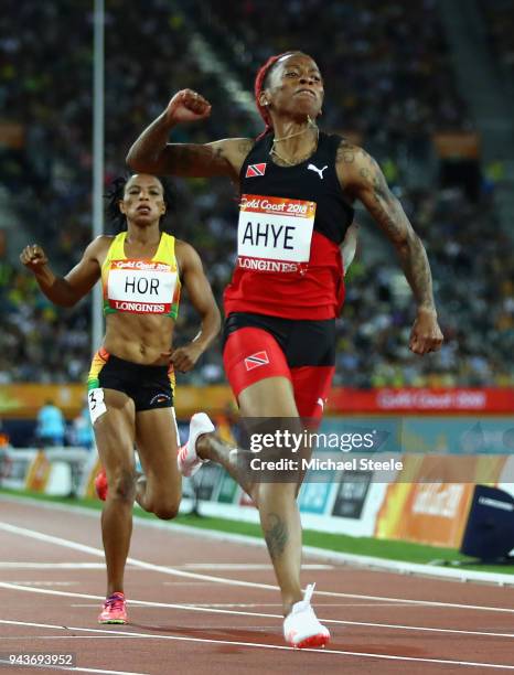 Michelle-Lee Ahye of Trinidad and Tobago celebrates winning gold as she crosses the finish line in the Women's 100 metres final during the Athletics...