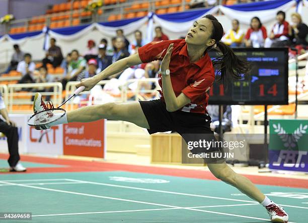 Malaysia's Wong Mew Choo returns a shuttlecock against Adriyanti Firdasari of Indonesia in their women's singles match of the women's team badminton...