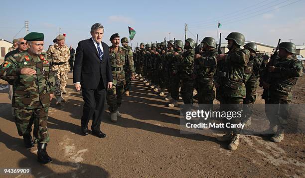 British Prime Minister Gordon Brown passes recently trained Afghan troops on December 13, 2009 in Camp Bastion, Afghanistan. Gordon Brown travelled...