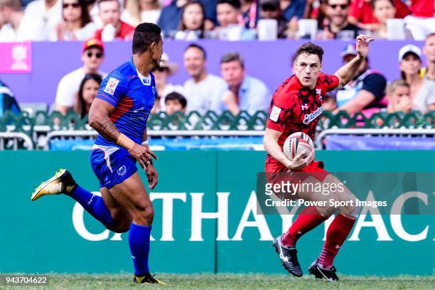 Tomi Lewis of Wales runs with the ball during the HSBC Hong Kong Sevens 2018 Shield Final match between Samoa and Wales on April 8, 2018 in Hong...