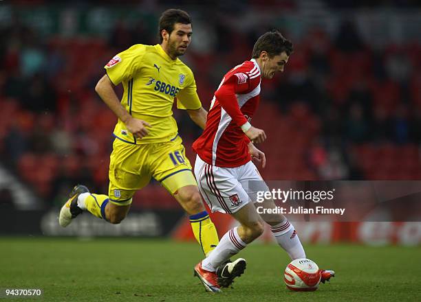 Adam Johnson of Middlesbrough holds off Joe Ledley of Cardiff during the Coca-Cola Championship match between Middlesbrough and Cardiff City at the...