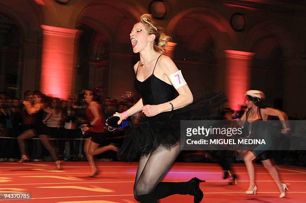 Women compete for the "Race on Heels" on November 20, 2009 in Paris.A total 96 shoe addicts, a common condition with fashionistas, have signed up for...