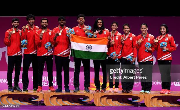The Indian Badminton Mixed team pose after winning gold in the Mixed Team gold match against Malaysia on day five of the Gold Coast 2018 Commonwealth...