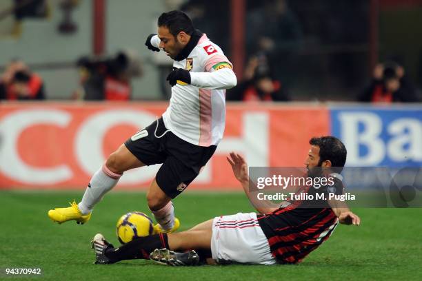 Giuseppe Favalli of Milan and Fabrizio Miccoli of Palermo compete for the ball during the Serie A match between AC Milan and US Citta di Palermo at...