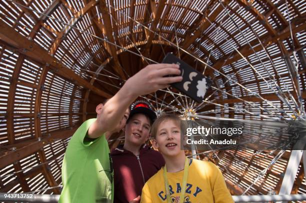 Children take a photo inside the Gulliver airship, a unique architectural intervention in the shape of an airship, in Prague, Czech Republic on April...