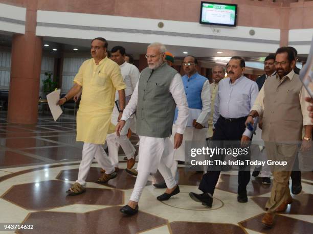 Prime Minister Narendra Modi along with Parliamentary Affairs Minister Ananth Kumar, Mukhtar Abbas Naqvi and other MPs leave after the BJP...