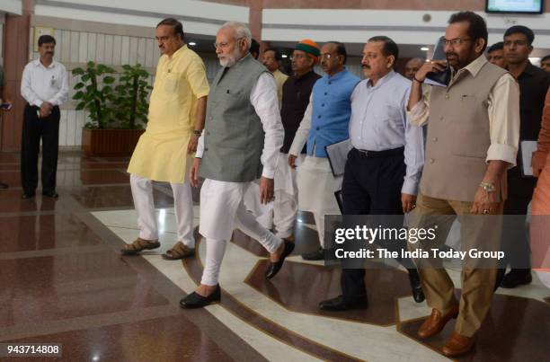 Prime Minister Narendra Modi along with Parliamentary Affairs Minister Ananth Kumar, Mukhtar Abbas Naqvi and other MPs leave after the BJP...