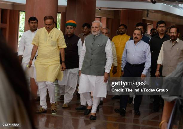 Prime Minister Narendra Modi along with Parliamentary Affairs Minister Ananth Kumar, Mukhtar Abbas Naqvi and other MPs leave after the BJP...