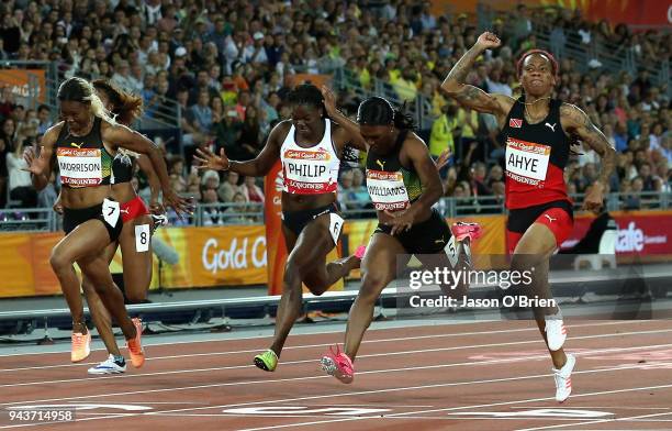 Michelle-Lee Ahye of Trinidad and Tobago celebrates as she wins gold ahead of Christania Williams of Jamaica and Asha Philip of England in the...