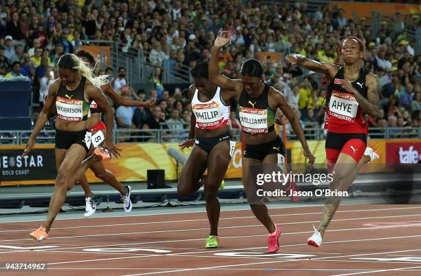 Michelle-Lee Ahye of Trinidad and Tobago celebrates as she wins gold ahead of Christania Williams of Jamaica and Asha Philip of England in the...