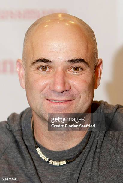 Former tennis player Andre Agassi poses at the signing of his new book 'Open: An Autobiography' at KulturBuehne at the Sphinx on December 13, 2009 in...