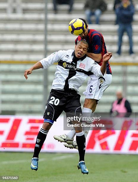 Jonathan Biabiany of Parma FC competes for the ball in the air with Miguel Angel Britos of Bologna FC during the Serie A match between Parma and...