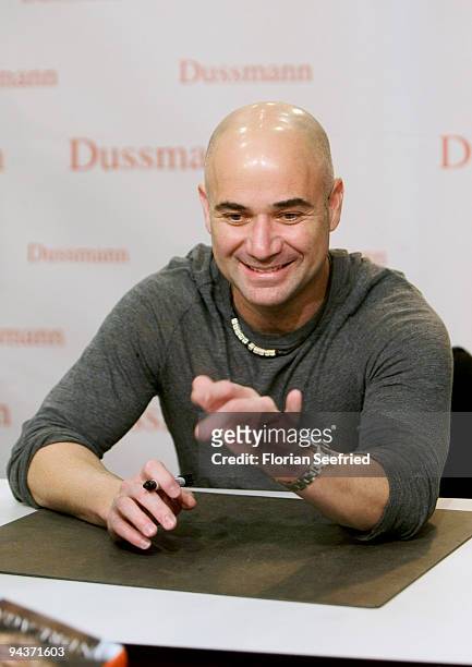 Former tennis player Andre Agassi signs copies of his new book 'Open: An Autobiography' at KulturBuehne at the Sphinx on December 13, 2009 in Berlin,...
