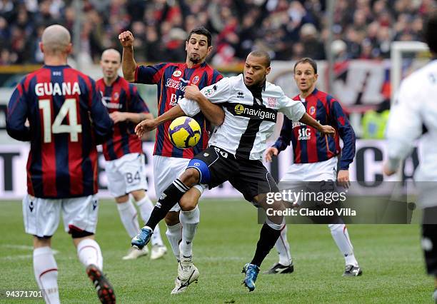 Jonathan Biabiany of Parma FC competes for the ball with Miguel Angel Britos of Bologna FC during the Serie A match between Parma and Bologna at...