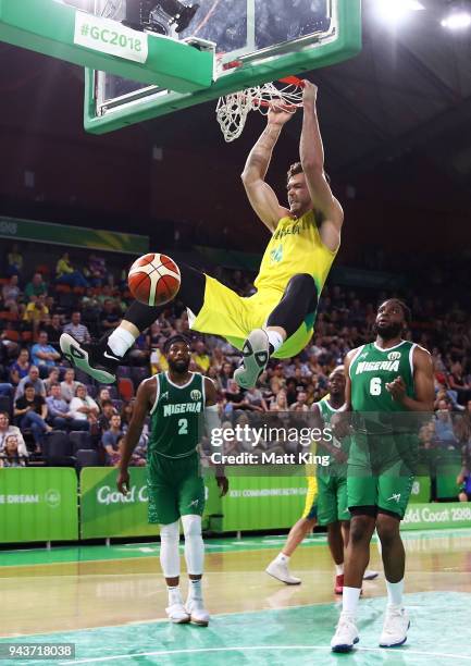 Angus Brandt of Australia slam dunks during the Preliminary Basketball round match between Australia and Nigeria on day five of the Gold Coast 2018...