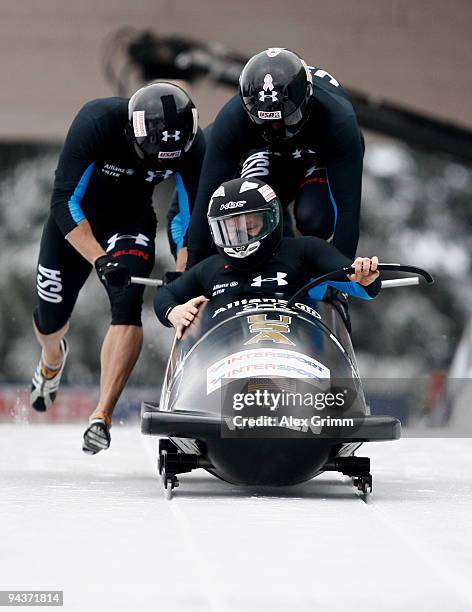 Pilot Steven Holcomb , Justin Olsen, Steve Mesler and Curtis Tomasevicz of USA compete in their first run of the four man bobsleigh competition...