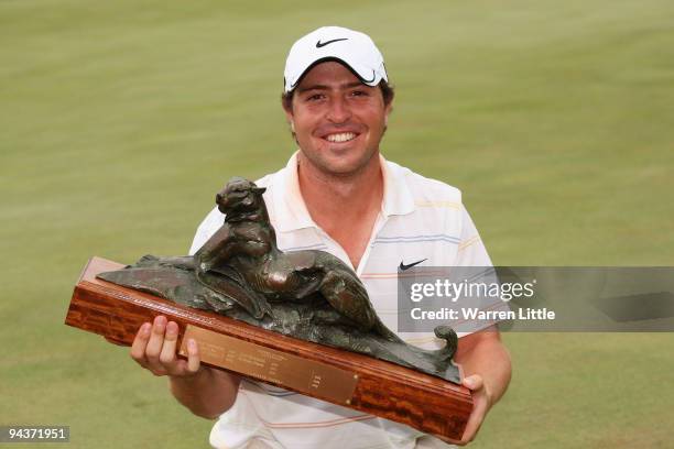 Pablo Martin of Spain poses with the trophy after winning the Alfred Dunhill Championship at Leopard Creek Country Club on a score of -17 on December...