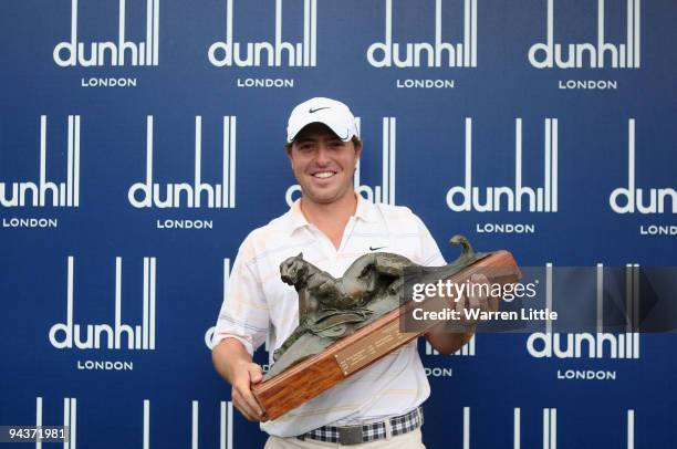 Pablo Martin of Spain poses with the trophy after winning the Alfred Dunhill Championship at Leopard Creek Country Club on a score of -17 on December...