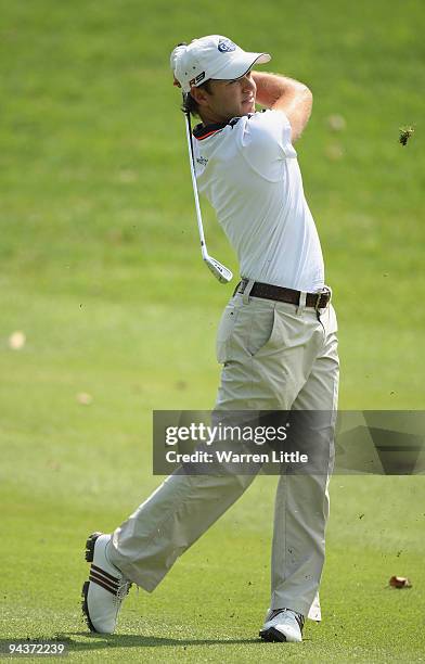 Richard Sterne of South Africa plays his second shot into the 13th green during the final round of the Alfred Dunhill Championship at Leopard Creek...