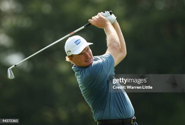 Ernie Els of South Africa plays his second shot into the 13th green during the final round of the Alfred Dunhill Championship at Leopard Creek...