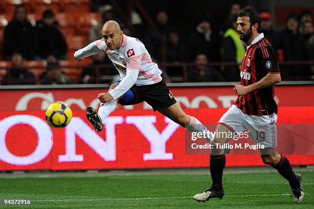 Mark Bresciano of Palermo kicks the ball as Giuseppe Favalli looks on during the Serie A match between AC Milan and US Citta di Palermo at Stadio...