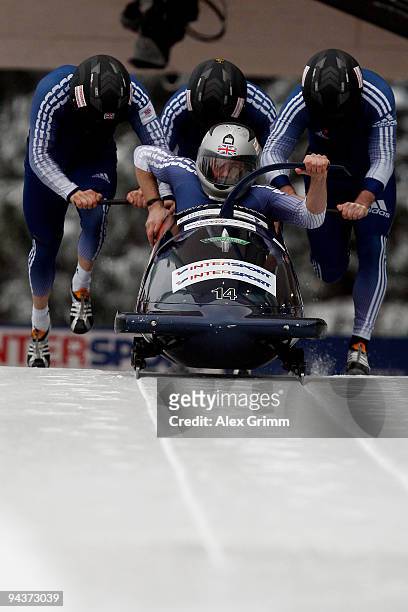 Pilot Lee Johnston and his team members Karl Johnston, Allyn Condon and Dan Money of Britain compete in their first run of the four man bobsleigh...