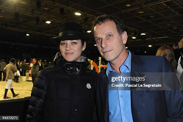 Actress Marion Cotillard and Actor Charles Berling attend the Gucci Grand Prix, International Jumping Competition presented by Equidia at Paris Nord...