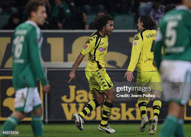 Patrick Owomoyela of Dortmund celebrates with his team mate Neven Subotic after scoring his team's third goal during the Bundesliga match between VfL...